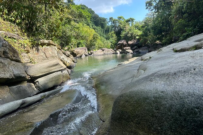 El Yunque & Beach Tour: Waterslide, Waterfall, Food, & Photos - What to pack for a wet rainforest day