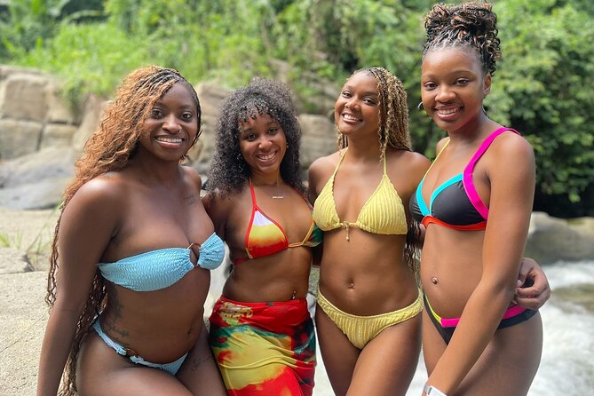 El Yunque: Waterslide and Plus Beach Round Trip - The rainforest waterslide and rocky walk