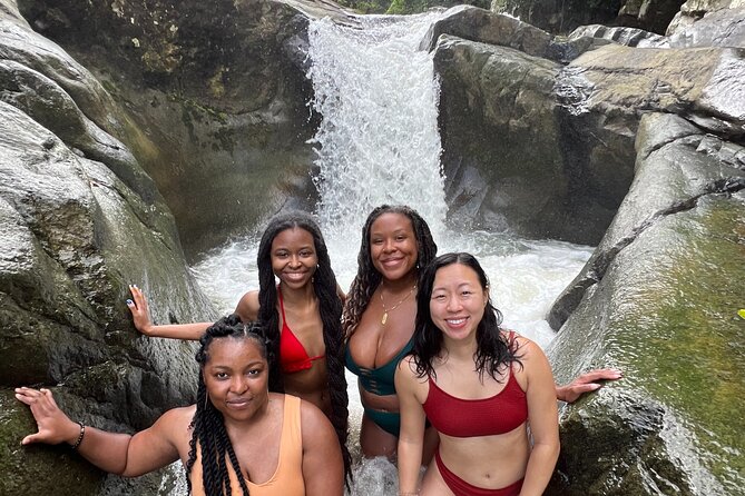 El Yunque Waterslide and Waterfall Tour with Food and Photos - The guide makes the difference on wet rock