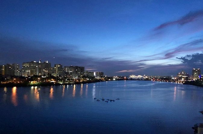 Night Kayak - Condado City Lights Tour - The two-foot step into the kayak