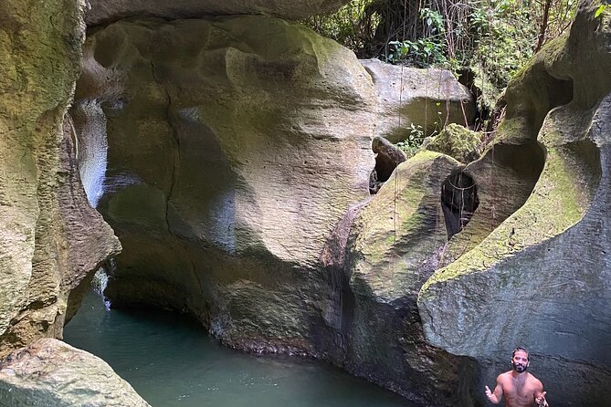 Rainforest Caves and Waterfalls Exploration with Transportation - Limestone caves, rock scrambling, and water crossings