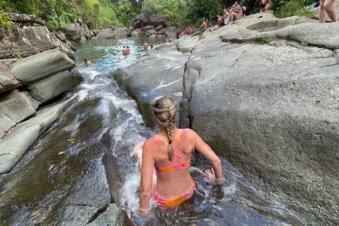 Rainforest Zipline, Luquillo Beach, and Natural Springs Day Trip - Natural springs, waterfalls, and the rock slide