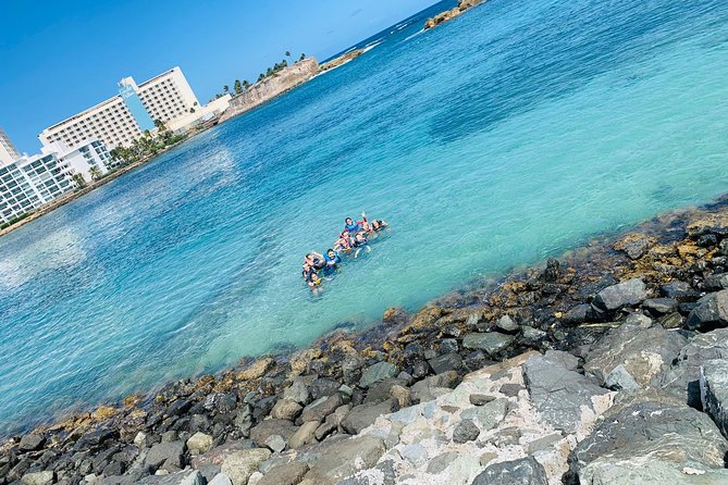 Snorkeling Guided Tour Experience in Condado Lagoon - Following the guide through Laguna del Condado