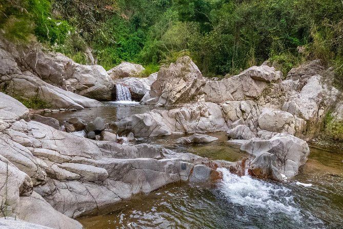 Utuado Canyon, River & Waterfall Adventure in Puerto Rico - Volcanic cliffs, giant rocks, and Taino carvings
