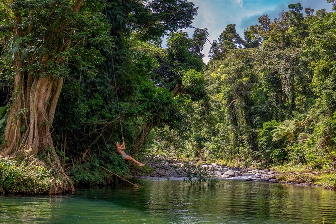 Yunque Rainforest River Rope Swing with Waterslide and Beach Tour - Luquillo’s volcanic rocks and natural swimming hole